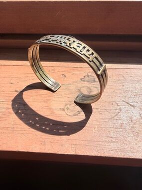 Om Namah Shivaya brass bracelet referred to as a kada cuff